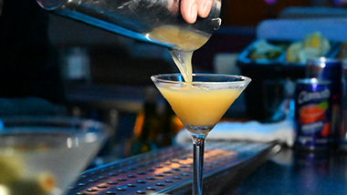Bartender Pouring Drink in Glass