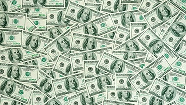 hundred dollar bills layed out.