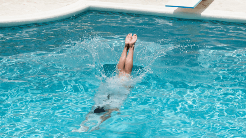 Woman diving into pool