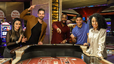 group playing craps at the M Resort