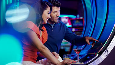 couple playing a slot machine